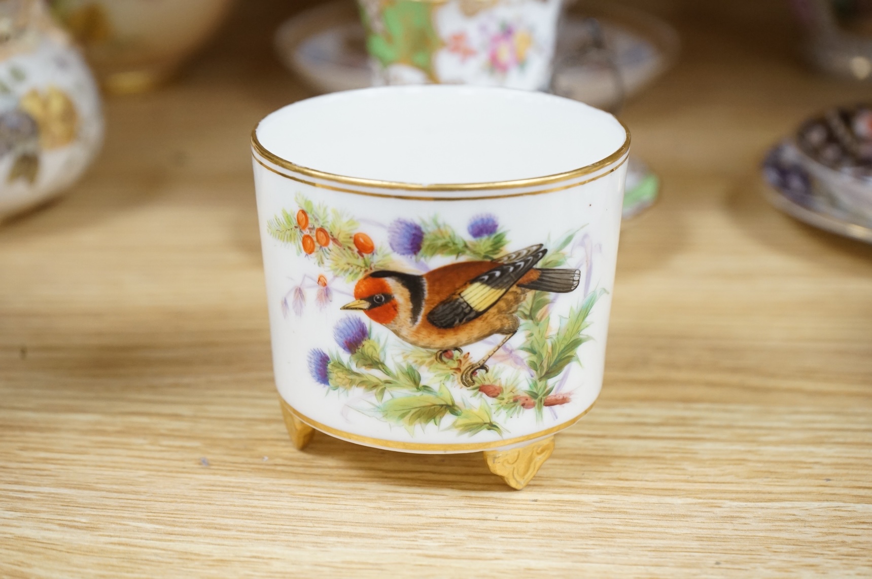 A Worcester butterfly handled cup and saucer and four other items, together with Royal Crown Derby, Dresden and Coalport items. (9). Tallest 13 cm